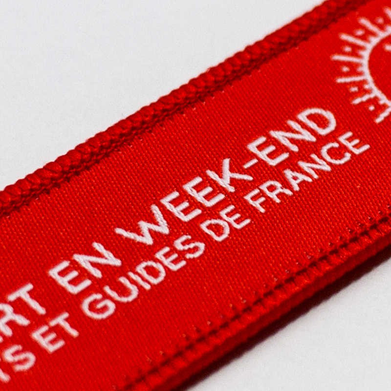 Porte-clés en tissu avec symboles Scouts et Guides de France