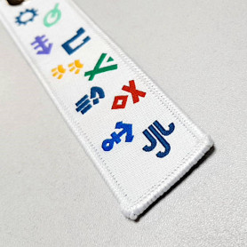 Porte-clés en tissu avec symboles Scouts et Guides de France