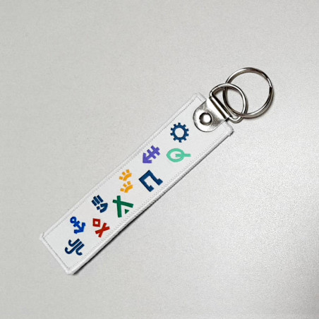 Porte-clés en tissu avec symboles Scouts et Guides de France Porte-clés en tissu avec symboles Scouts et Guides de France